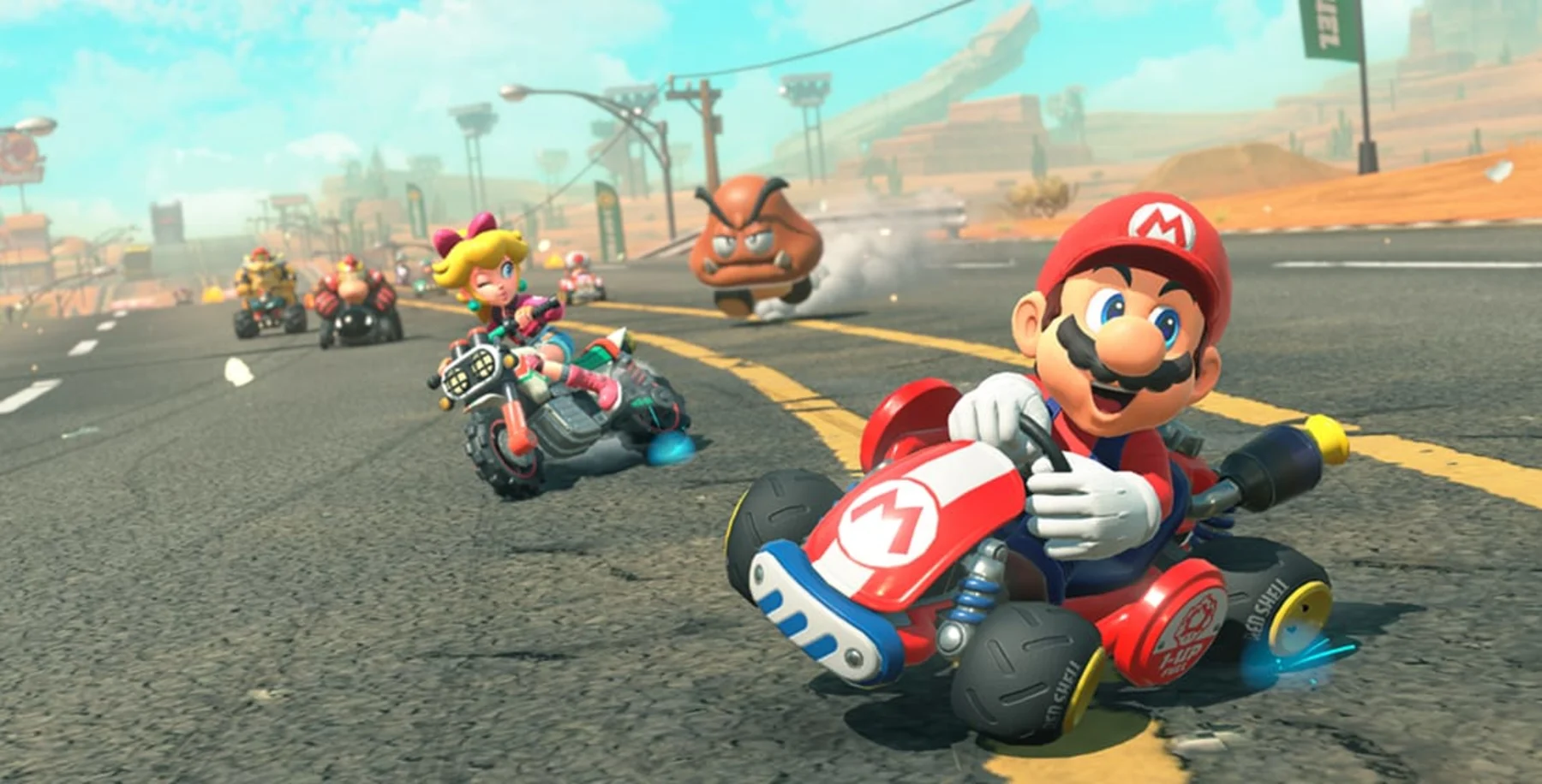 Mario, Peach e outros pilotos disputam uma corrida em Mario Kart World